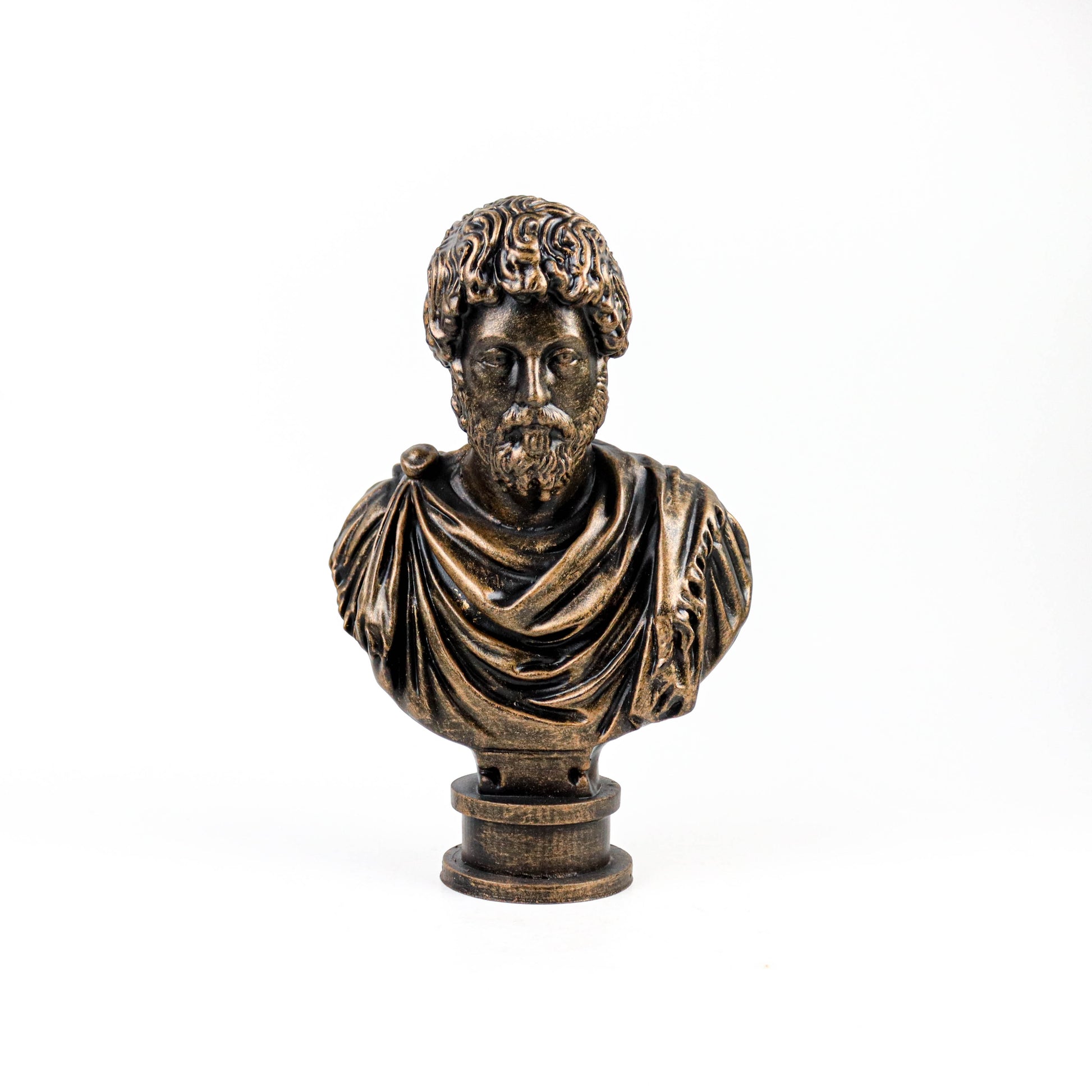A bronze bust of a bearded man wearing a draped robe, standing against a white background.