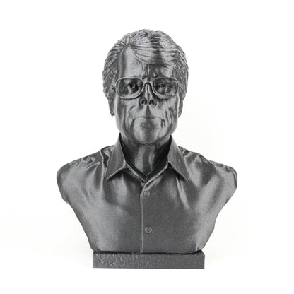 A black and white image of a bust sculpture depicting a man wearing glasses.
