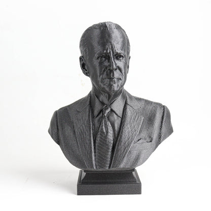 A black and white bust sculpture of a man wearing a suit and tie.