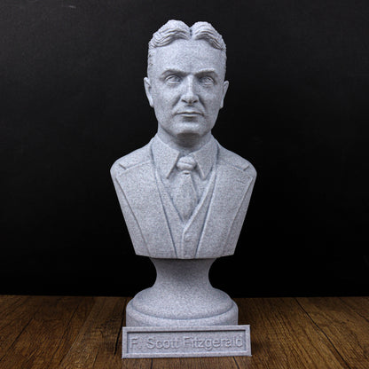 A bust of a man wearing a suit and tie, with the name "F. Scott Fitzgerald" displayed below the statue.