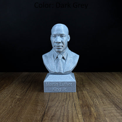 A bust of Martin Luther King Jr. is displayed on a wooden surface, with the text "Martin Luther King Jr." engraved below it.