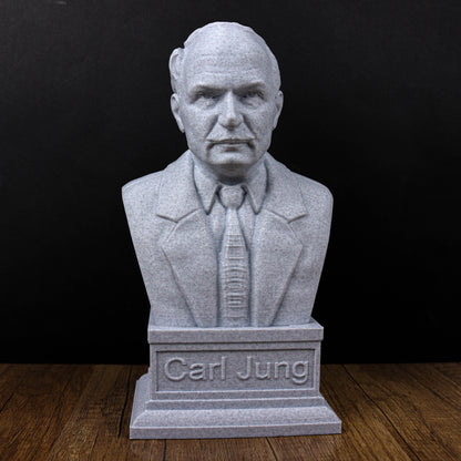 A bust of a man wearing a suit and tie, with the name "Carl Jung" engraved on the base.