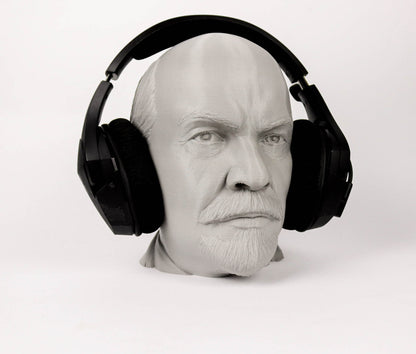 A 3D printed head wearing black headphones.